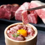 「薪焼きともつ鍋 桂香-KEIKA- 博多西中洲」にてA5黒毛和牛をひつまぶしスタイルで堪能する新ランチ『博多牛まぶし』が2026年7月20日より登場